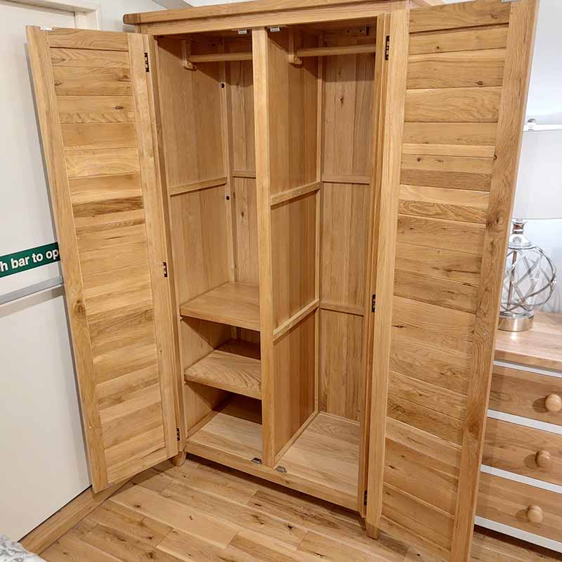 solid oak wardrobe with adjustable shelves and solid oak hanging clothes rails