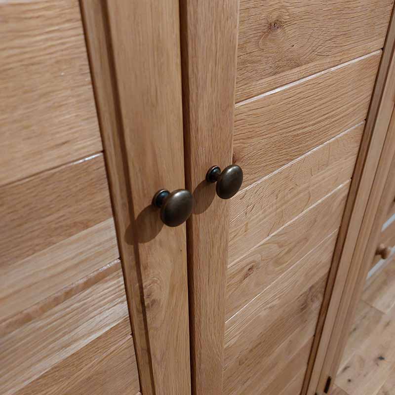 solid oak slatted doors fitted with antique brass knobs